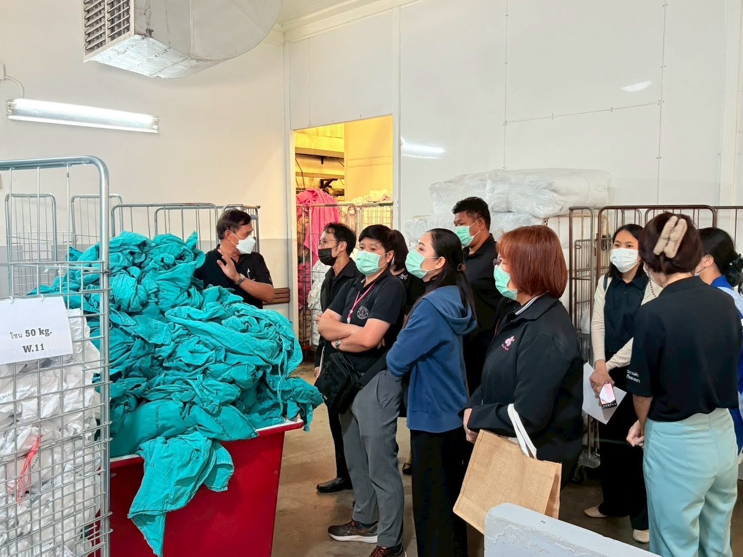 Ideal Laundry staff receiving and sorting soiled hospital linen in the segregated collection zone